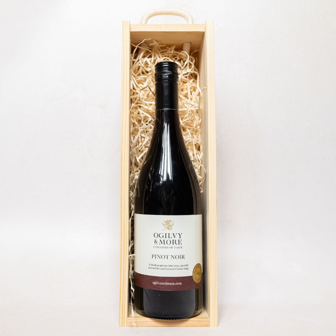 Bottle of Ogilvy & More Pinot Noir wine in a smart wooden gift box