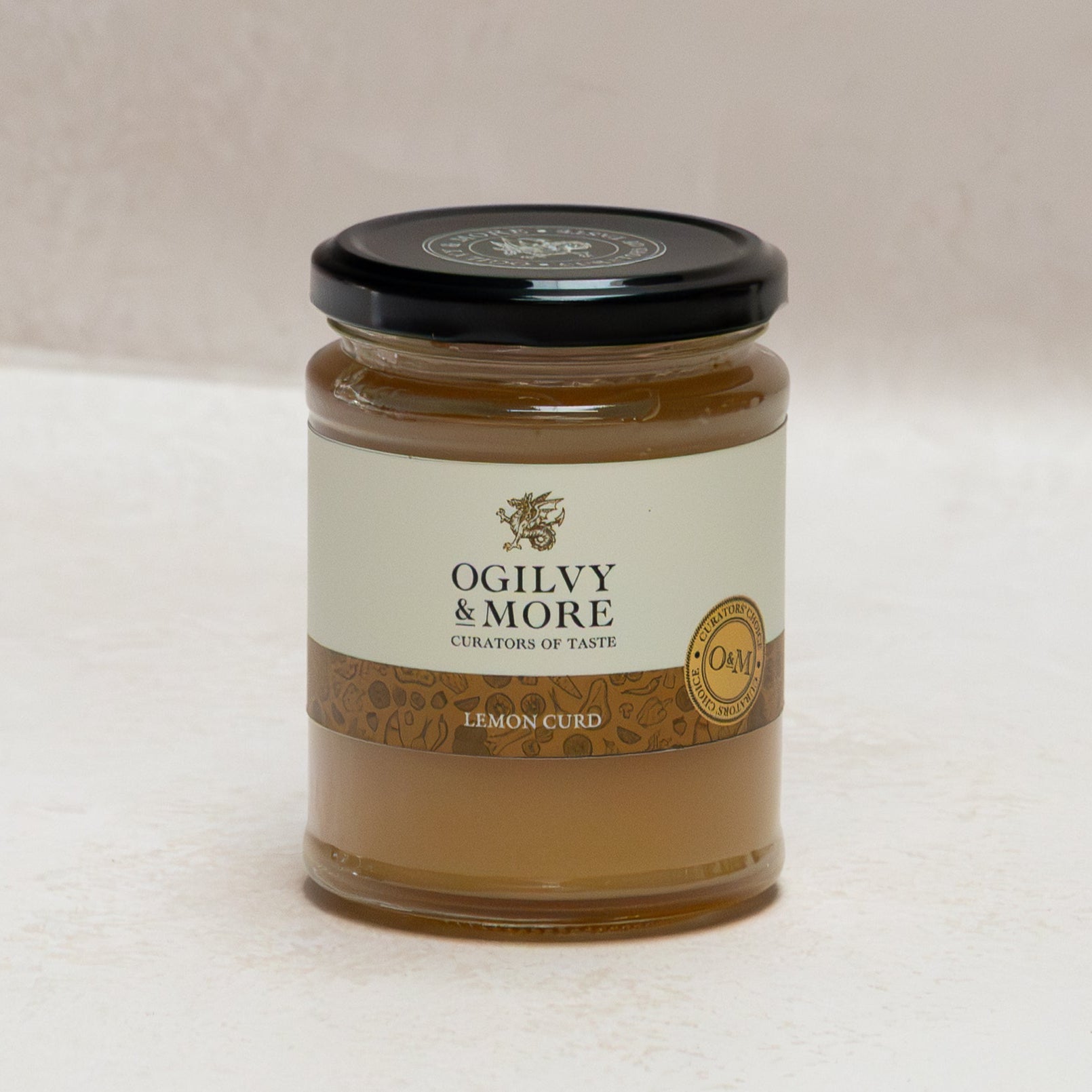 Jar of Ogilyv & More lemon curd on a white background