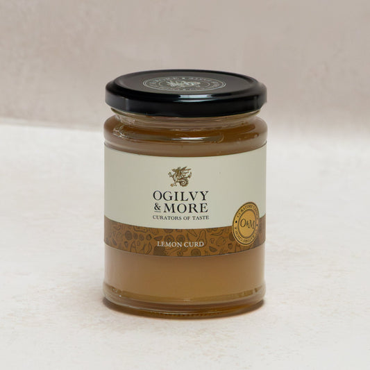Jar of Ogilyv & More lemon curd on a white background