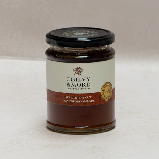 Jar of Ogilvy & More Seville fine cut marmalade on a white background