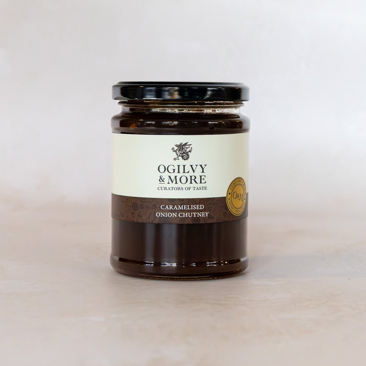 Jar of Ogilvy & More caramelised onion chutney on a white background