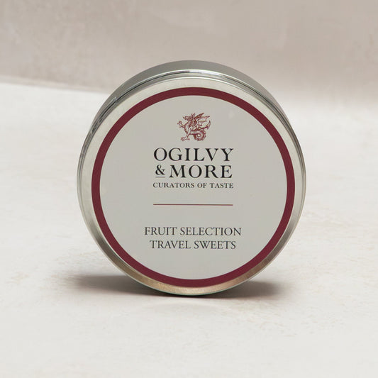 Ogilvy & More travel sweets tin on a light background