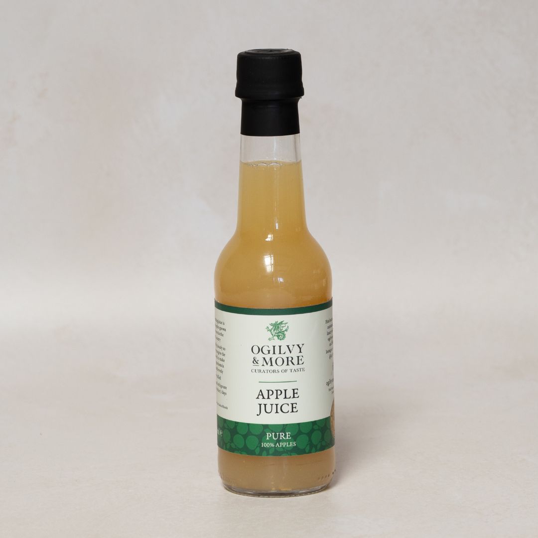 Bottle of Ogilvy & More Apple Juice on a light gray background