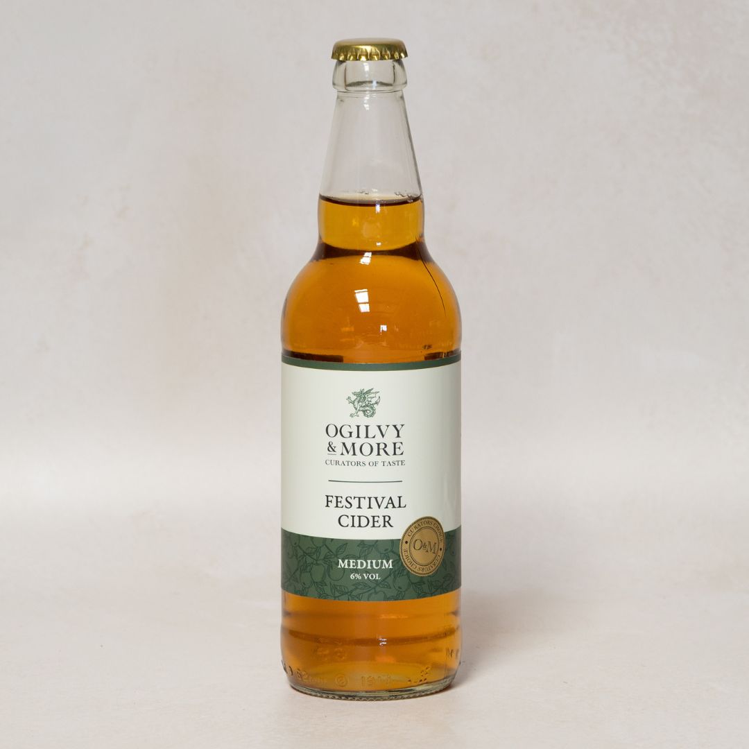 Bottle of Ogilvy & More Festival Cider on a white background