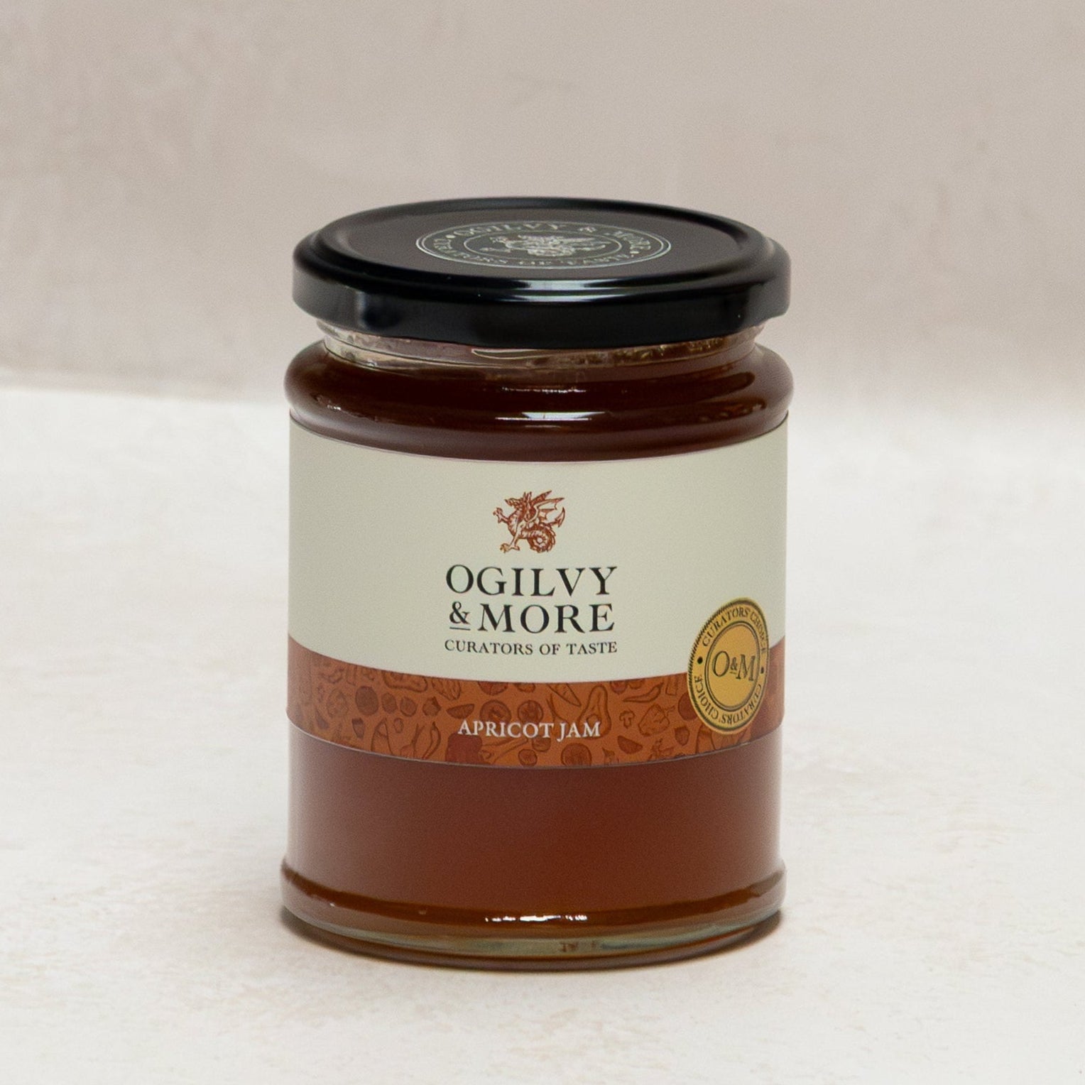Jar of Ogilvy & More apricot jam on a white background