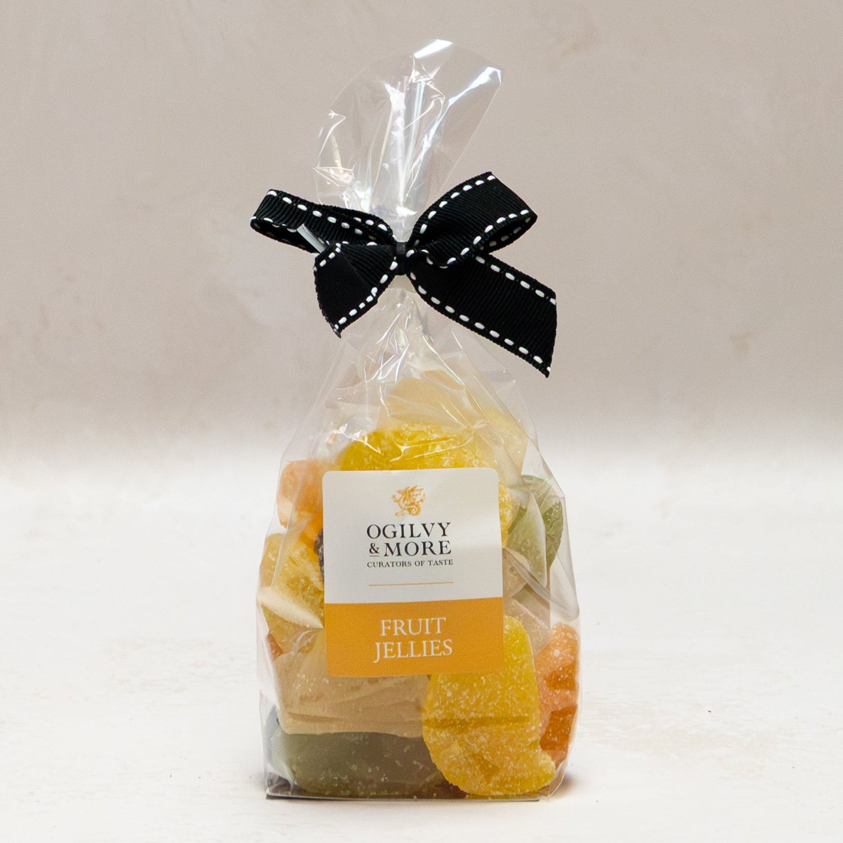 Bag of Ogilvy & More fruit jellies with a black bow on a white background