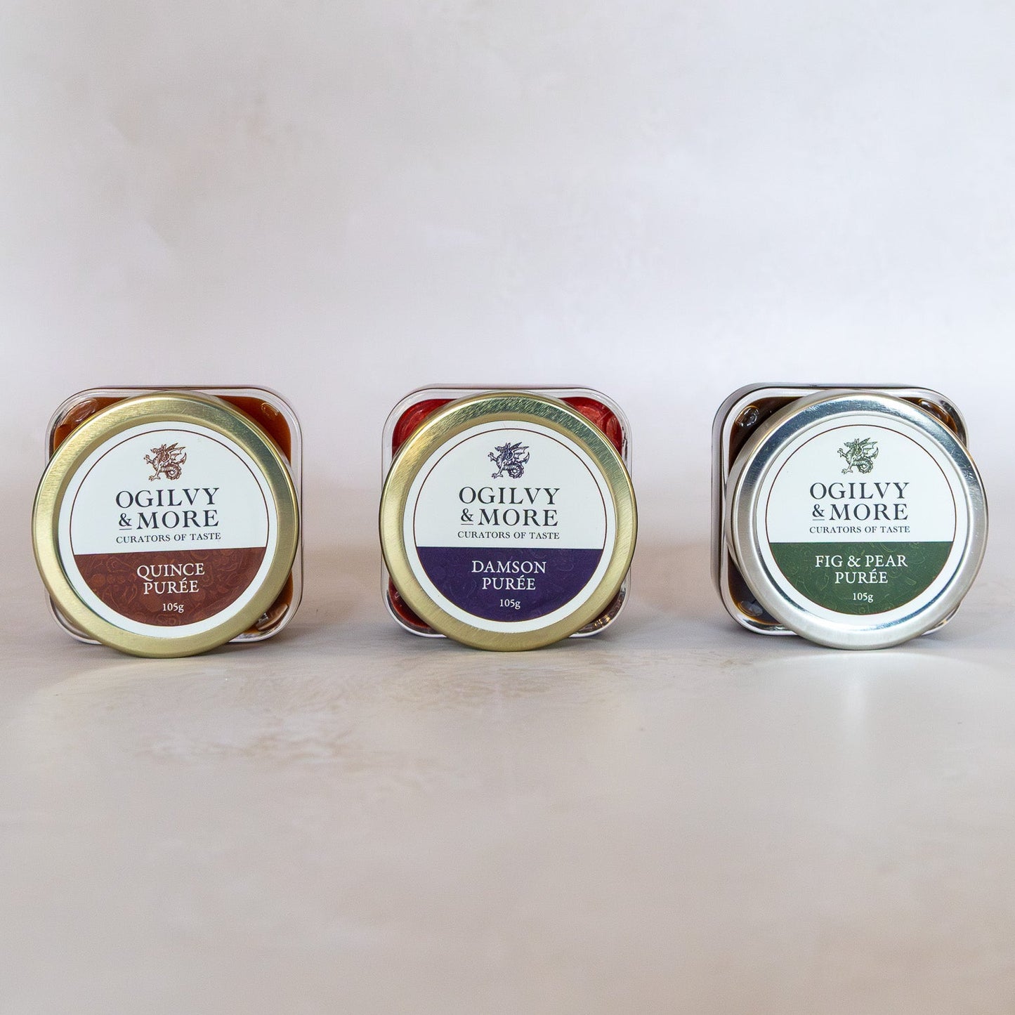 Three jars of Ogilvy & More purees on a light background