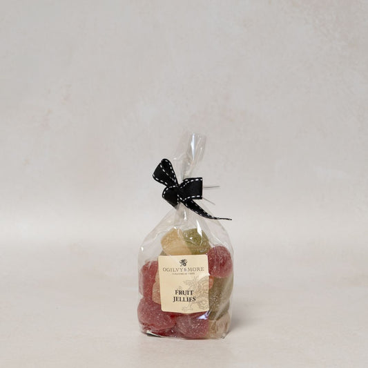 Bag of Ogilvy & More fruit jellies with a black bow on a white background