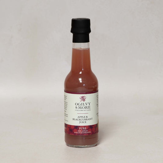 Bottle of Ogilvy & More Apple & Blackcurrant Juice on a light gray background