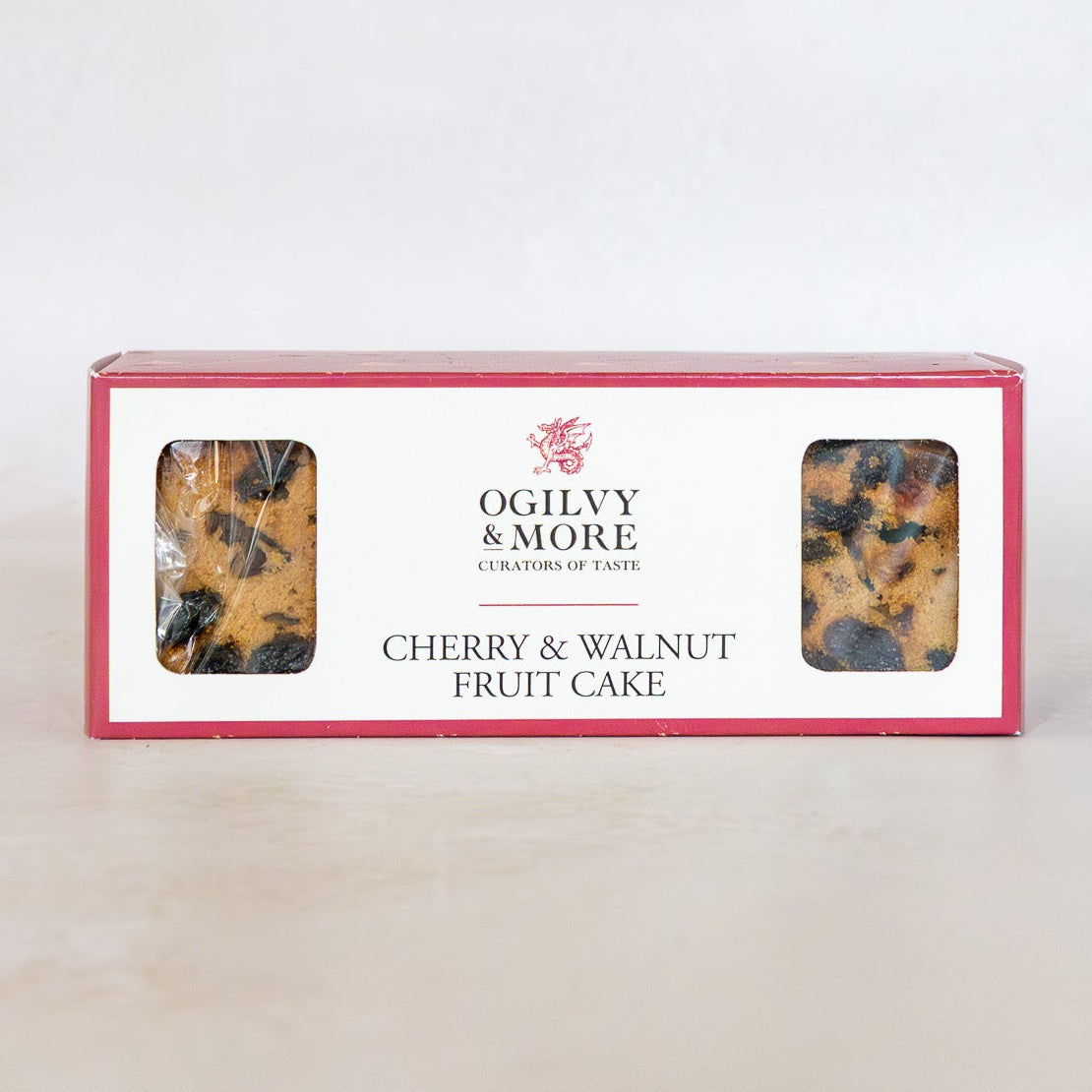 Box of Ogilvy & More Cherry & Walnut Fruit Cake on a white background