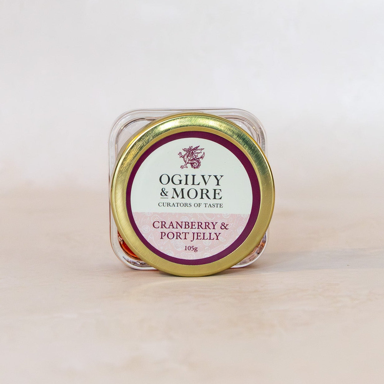 Jar of Ogilvy & More Cranberry & Port Jelly on a light beige background