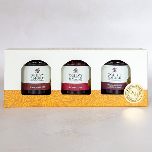 Three Jars of Ogilvy & More Jam in a decorative box on a light gray background