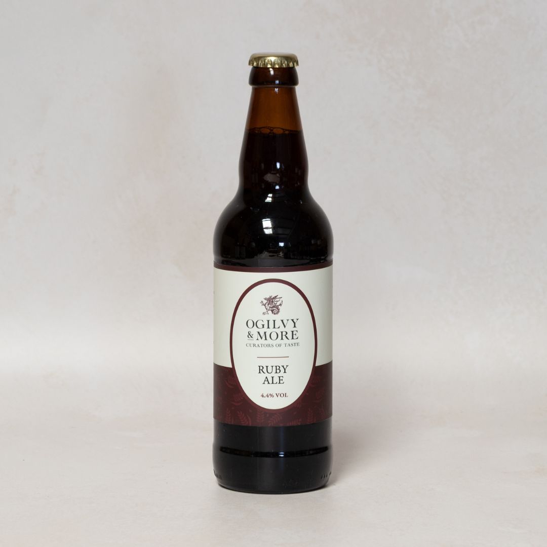 Bottle of Ogilvy & More Ruby Ale on a light gray background