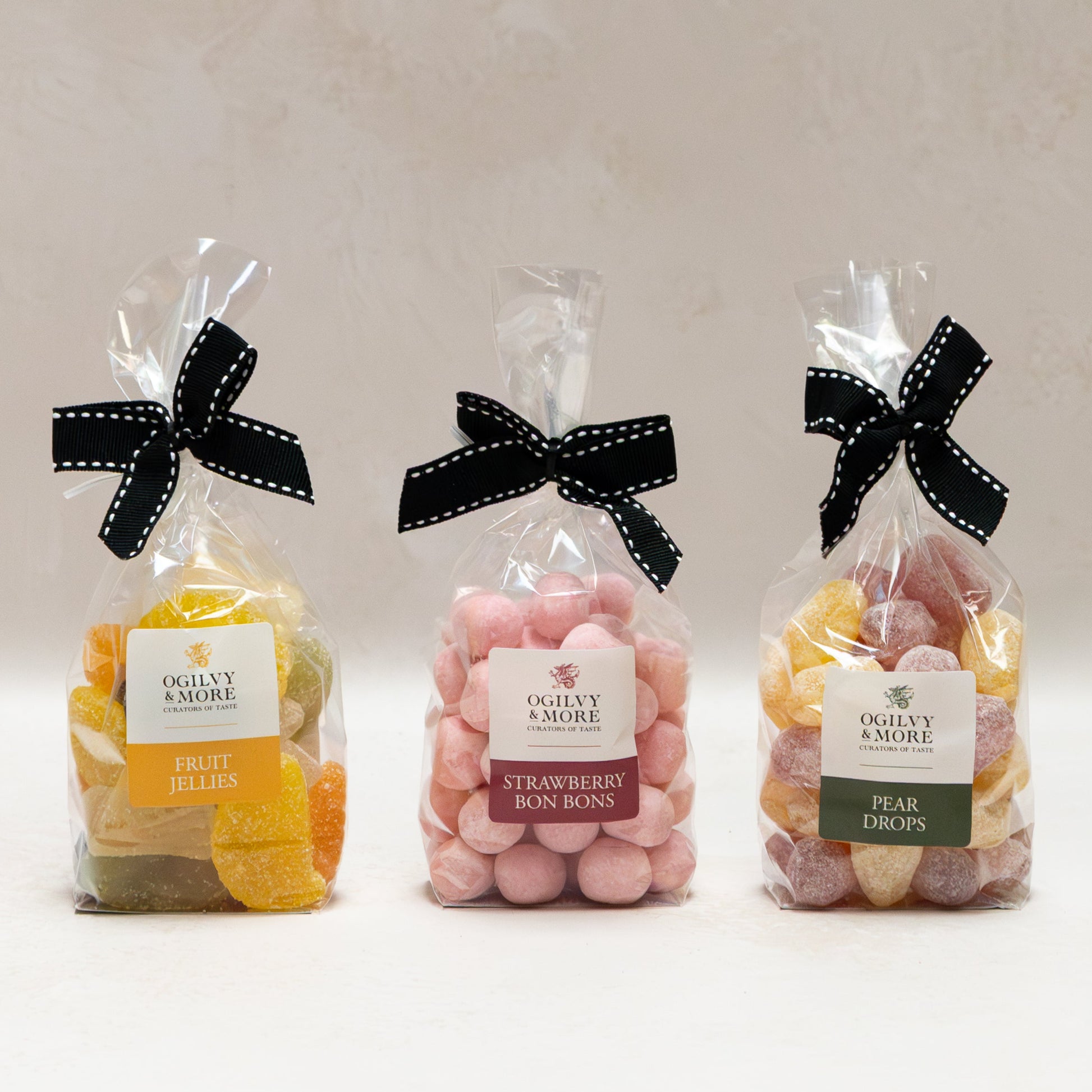 Ogilvy & More Sweet Trio with black bows on a white background