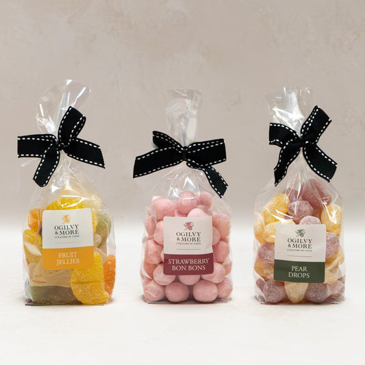 Ogilvy & More Sweet Trio with black bows on a white background