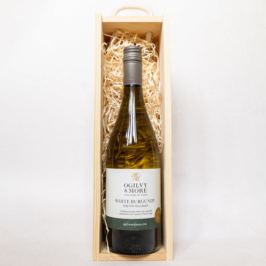 Ogilvy & More White Burgundy bottle in a wooden box with straw lining on a white background