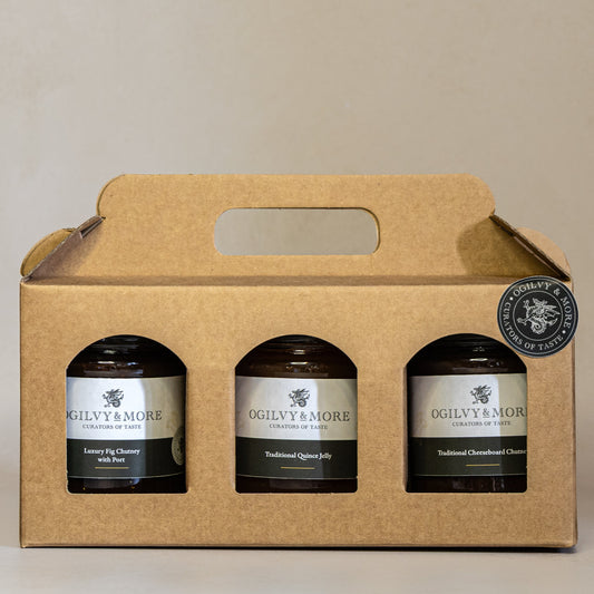 Three jars of Ogilvy & More chutney in a cardboard carrier on a beige background