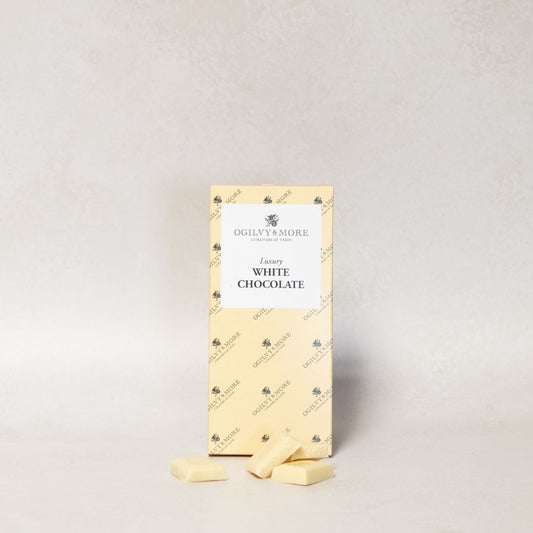 Packet of Ogilvy & More luxury white chocolate on a light gray background