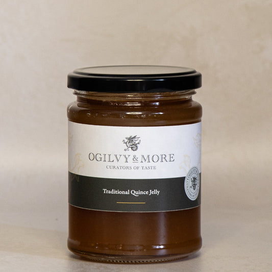 Jar of Ogilvy & More traditional quince jelly on a beige background