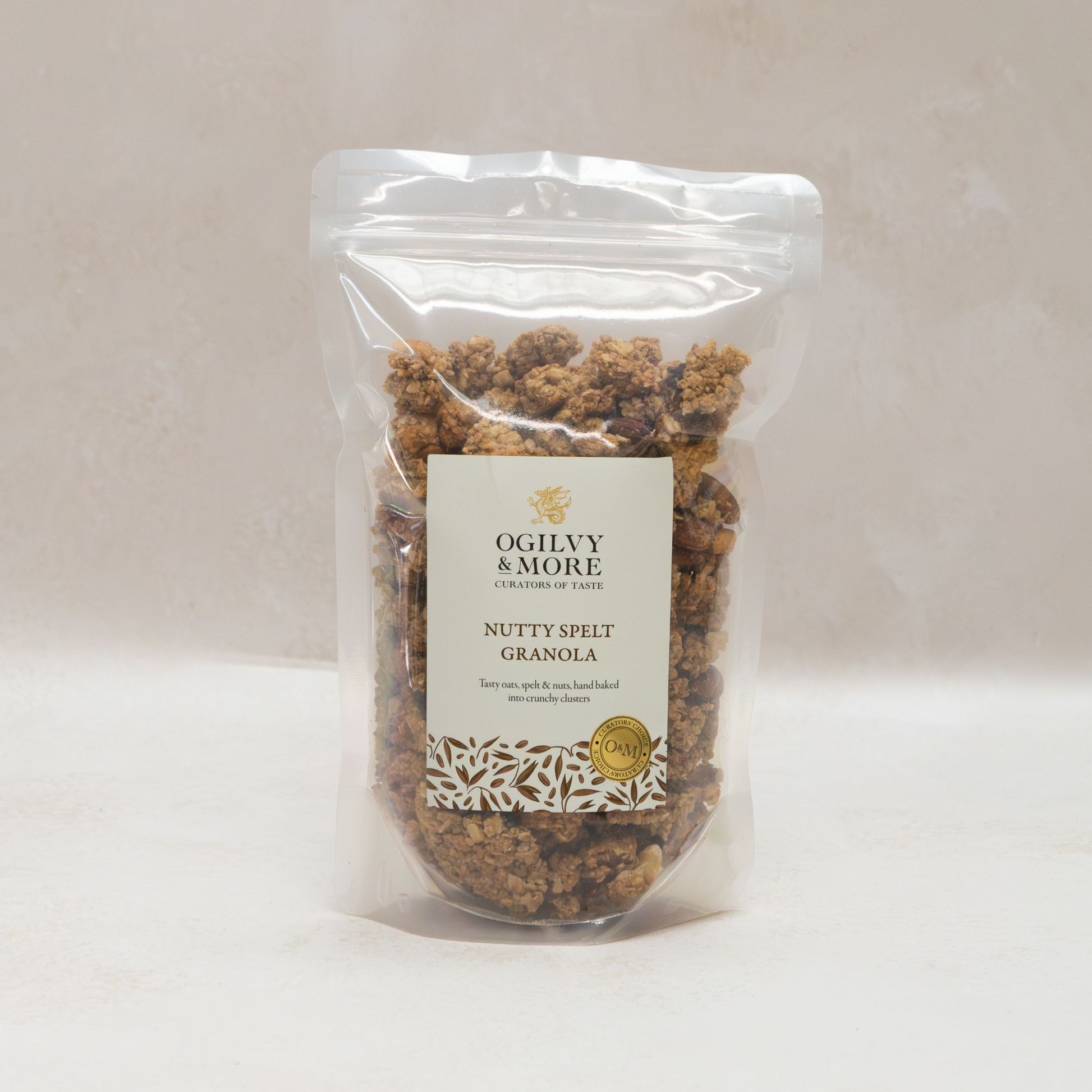 Packaged nutty spelt granola with Ogilvy & More label on a white background